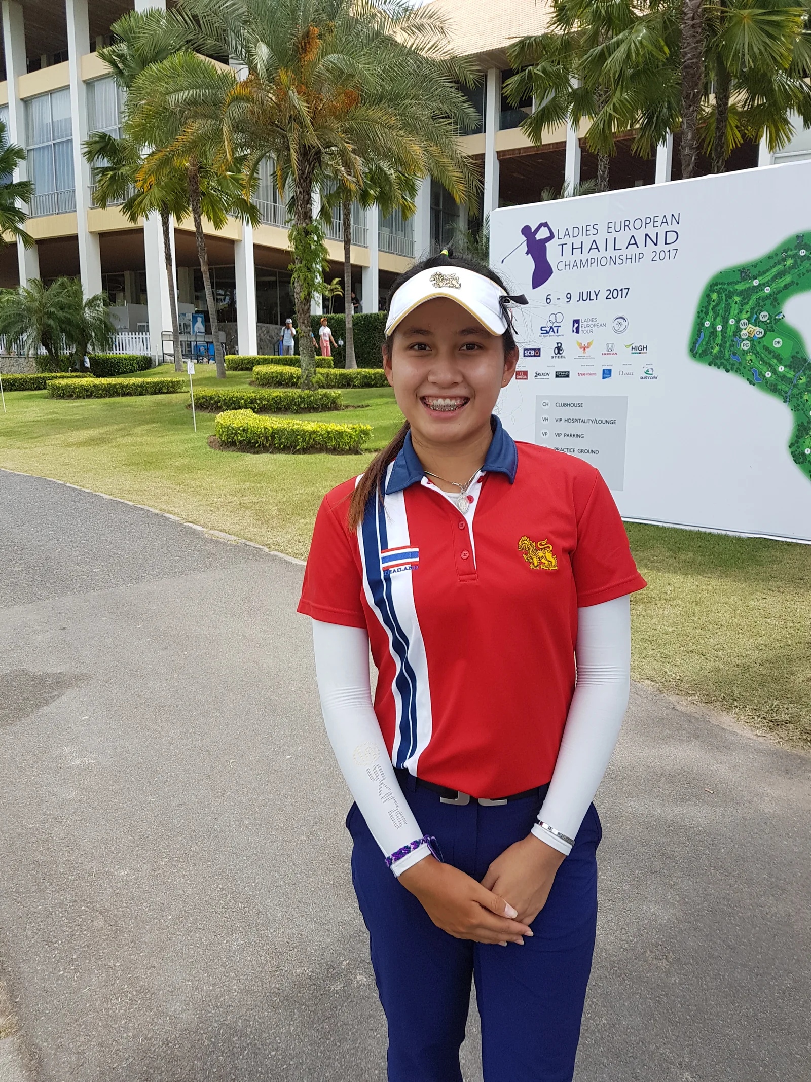 Atthaya Thitikul beside the Ladies European Thailand Championship 2017 sign outside the Phoenix Gold clubhouse in July 2017.
